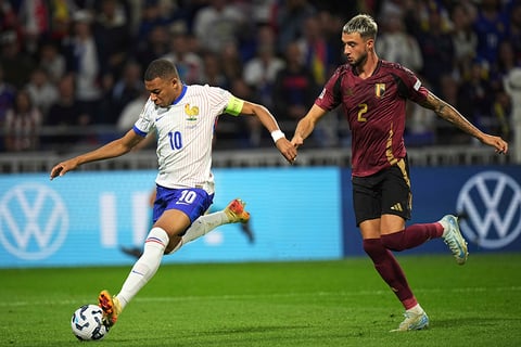 2024–25 UEFA Nations League, France vs Belgium: France's Kylian Mbappe, left, controls the ball as Belgium's Zeno Debast tries to stop him